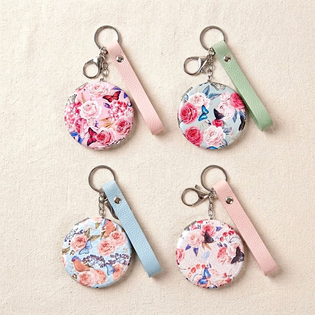 Llavero con espejo floral y mariposas
